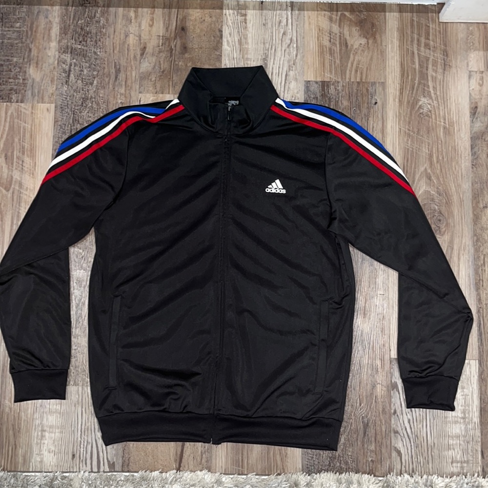 Black Adidas Jacket with red, white, and blue stripe along the sleeve.